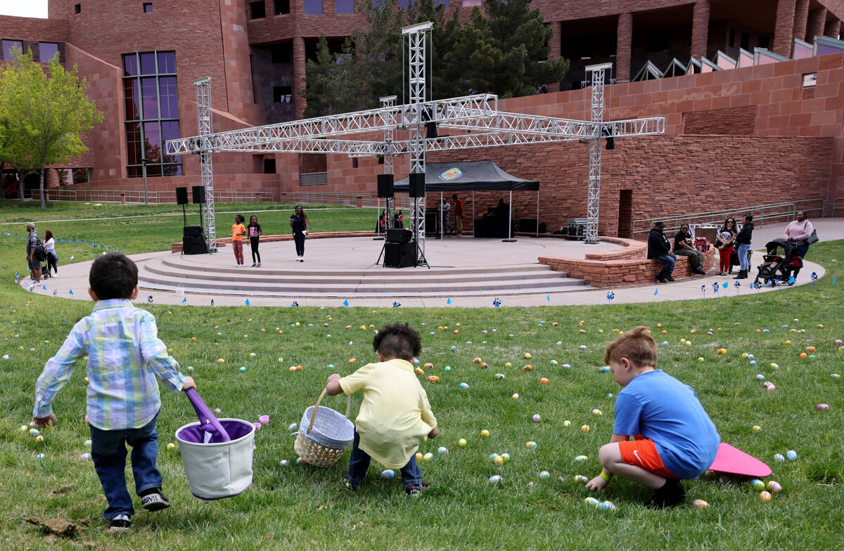 Unidentified foster children collect eggs during a hunt as part of a foster parent resource fai ...