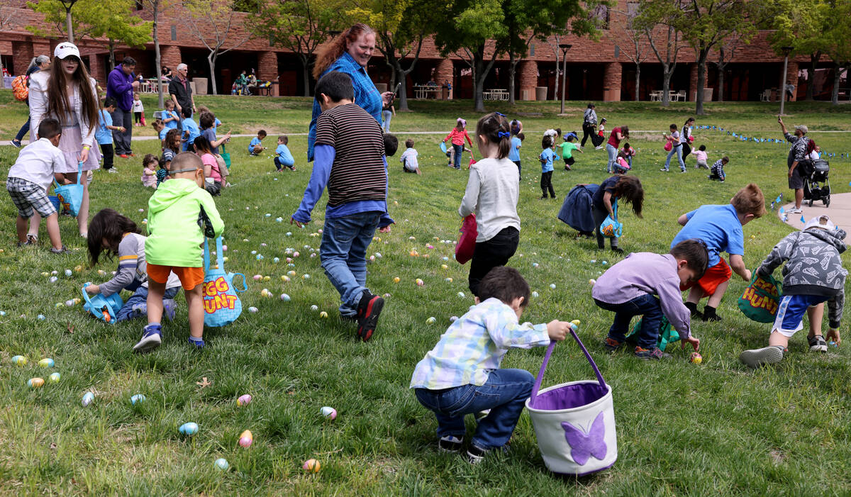 Unidentified foster children collect eggs during a hunt as part of a foster parent resource fai ...