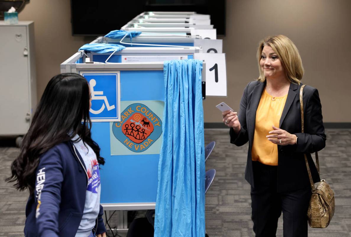 tHenderson Mayor Michelle Romero shows her activation card after voting at Henderson City Hall ...