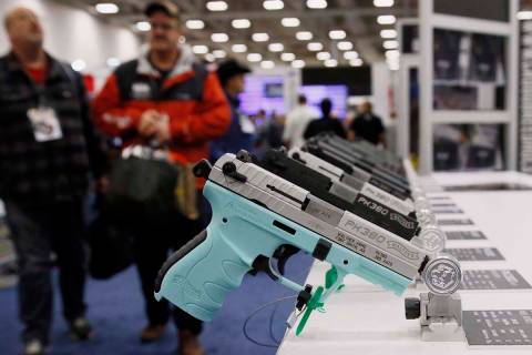 FILE - In this May 4, 2018, file photo, handguns are on display at the NRA convention in Dallas ...