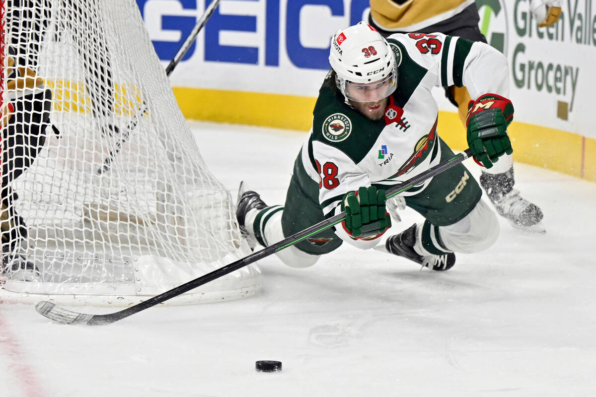 Minnesota Wild right wing Ryan Hartman (38) dives for the puck during the third period of the t ...