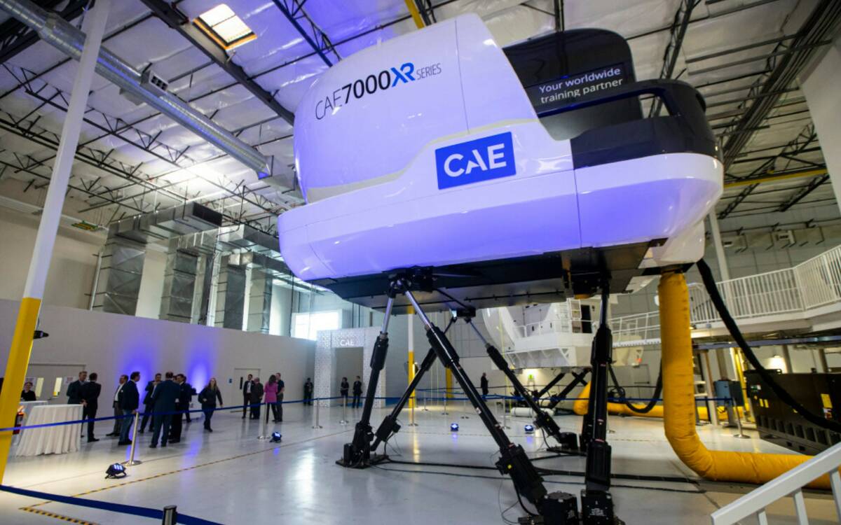 One of seven of the currently operating full-flight simulators is seen as people arrive for a r ...