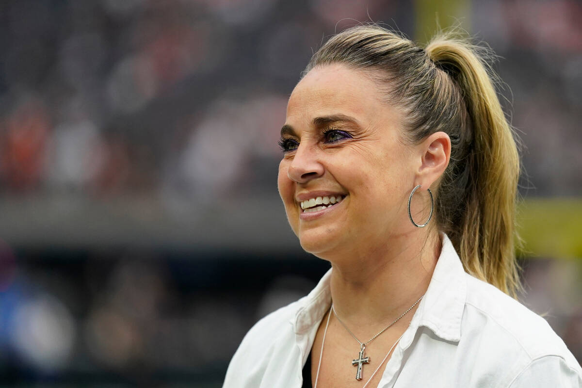 FILE - Las Vegas Aces coach Becky Hammon stands on the field before of an NFL football game bet ...