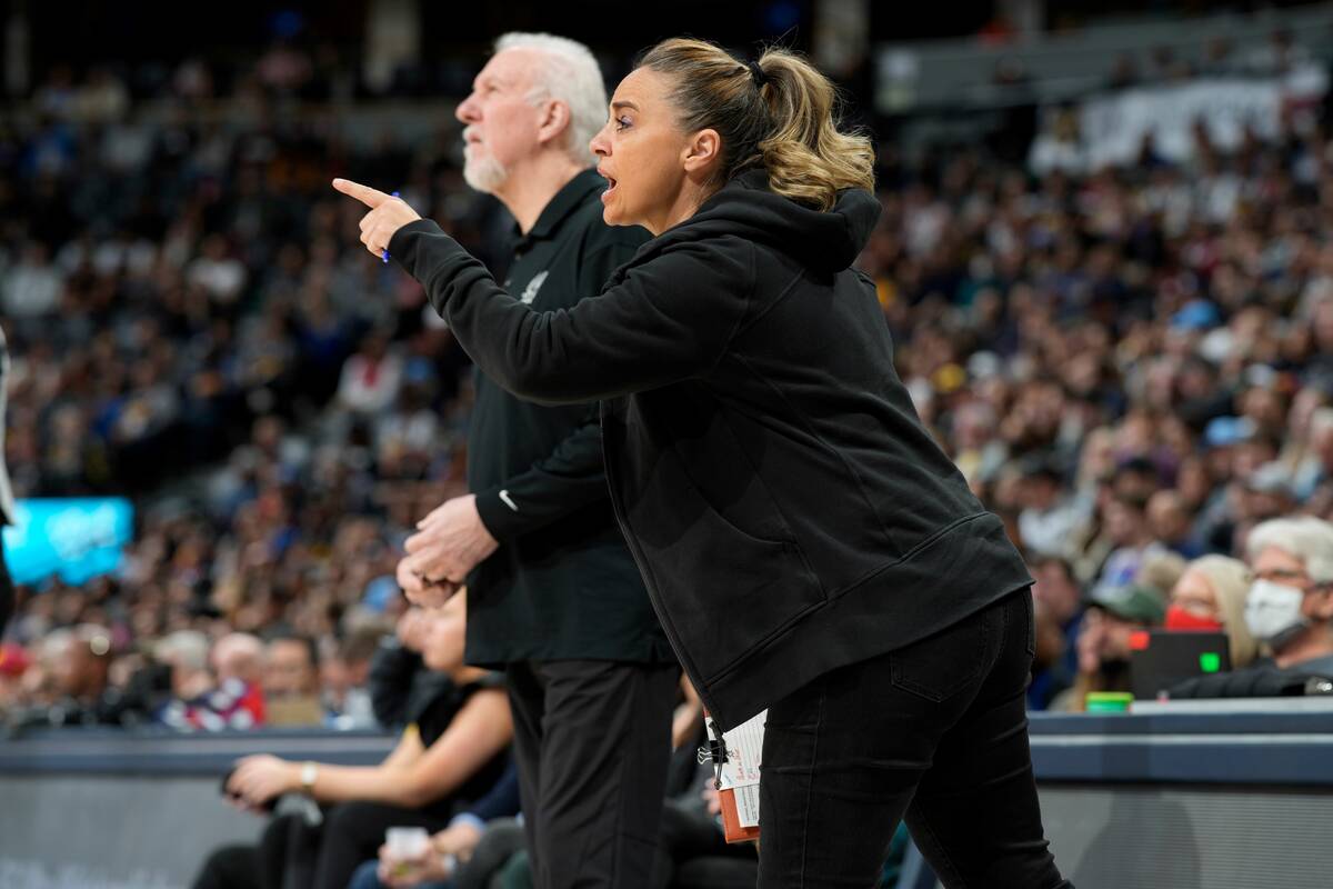 San Antonio Spurs assistant coach Becky Hammon, front, talks to players, next to coach Gregg Po ...