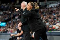 San Antonio Spurs assistant coach Becky Hammon, front, talks to players, next to coach Gregg Po ...