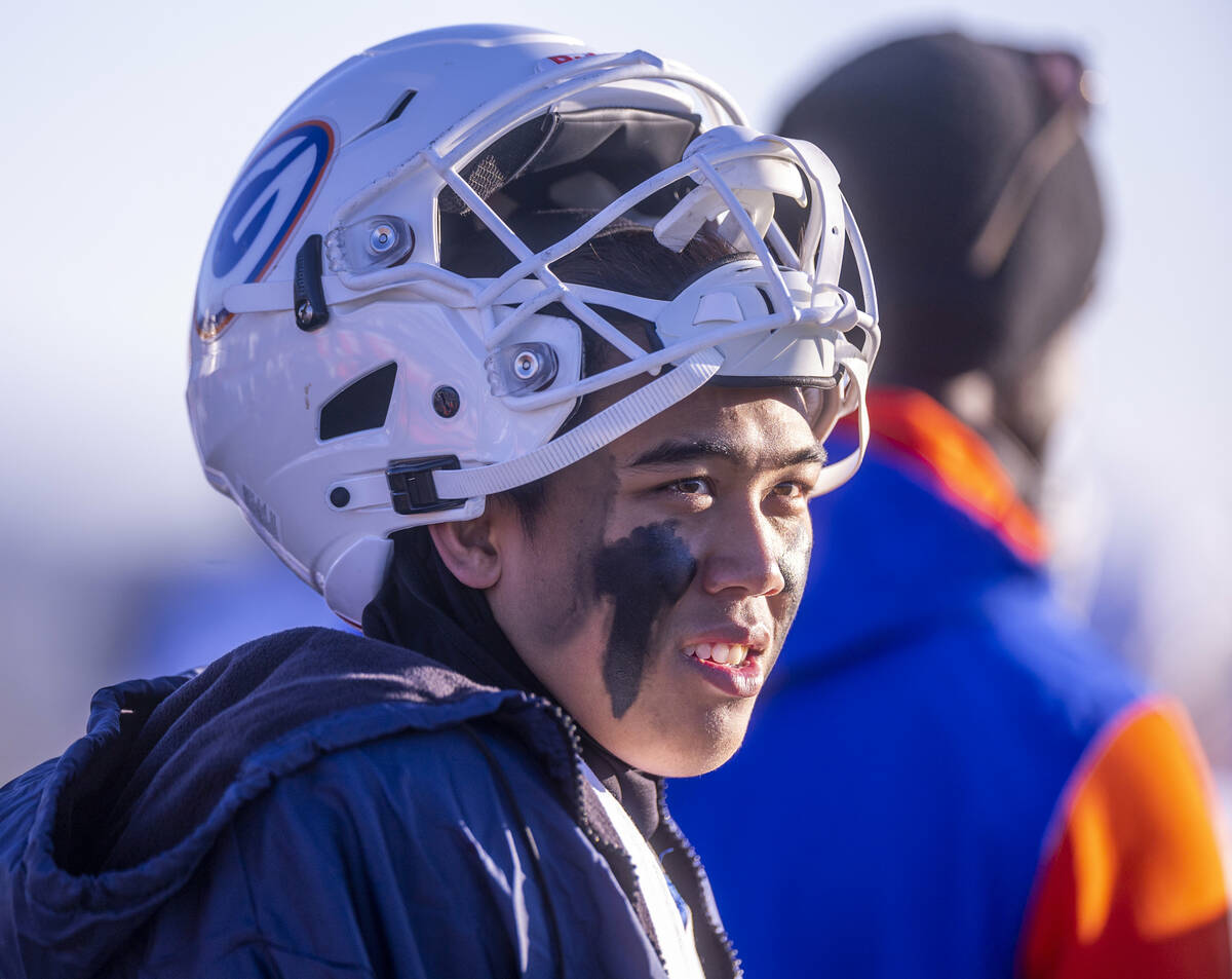 Bishop Gorman QB Micah Alejado (12) looks on from the sidelines as they dominate Bishop Manogue ...