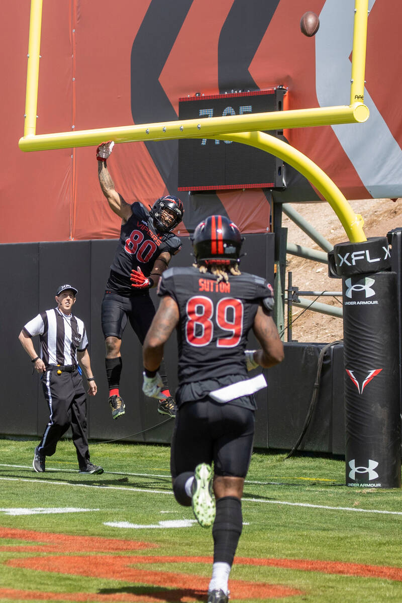 Vegas Vipers tight end Sean Price (80) spikes the ball over the uprights after scoring on a two ...