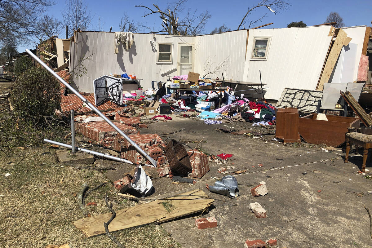 Debris covers the ground around damaged homes in Wynne, Ark., on Saturday, April 1, 2023. Unre ...