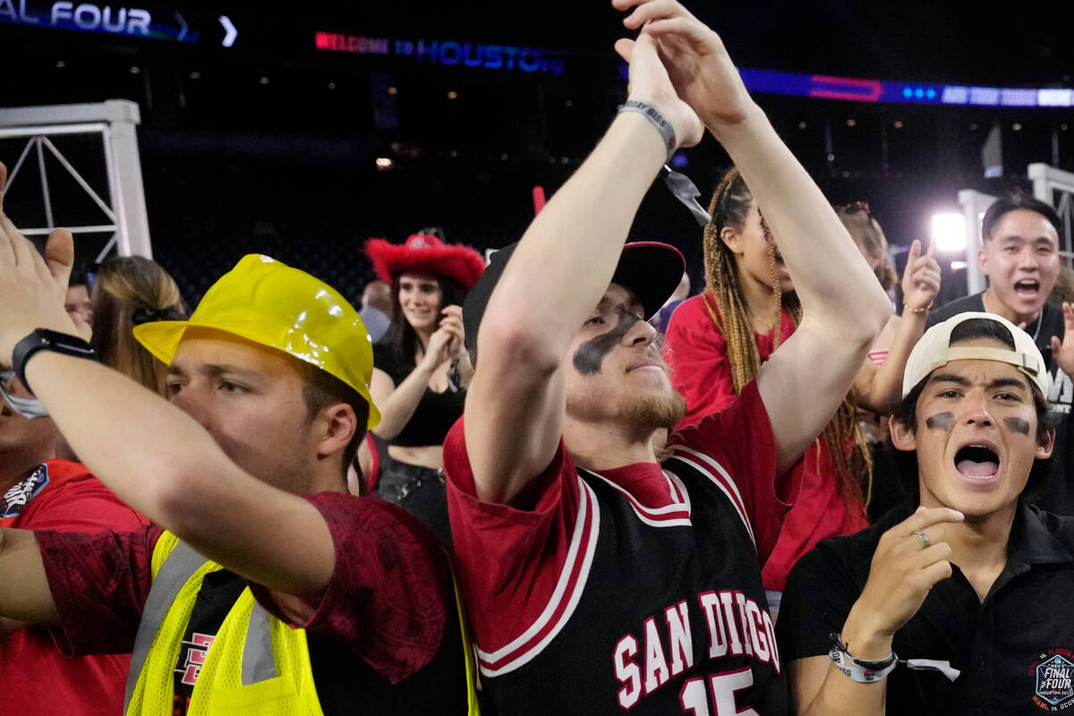 Fans cheer before a Final Four college basketball game between San Diego State and Florida Atla ...