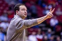 UNLV head coach Kevin Kruger signals his players against Utah State during the second half of t ...