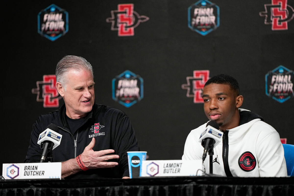 San Diego State head coach Brian Dutcher speaks about guard Lamont Butler during a news confere ...