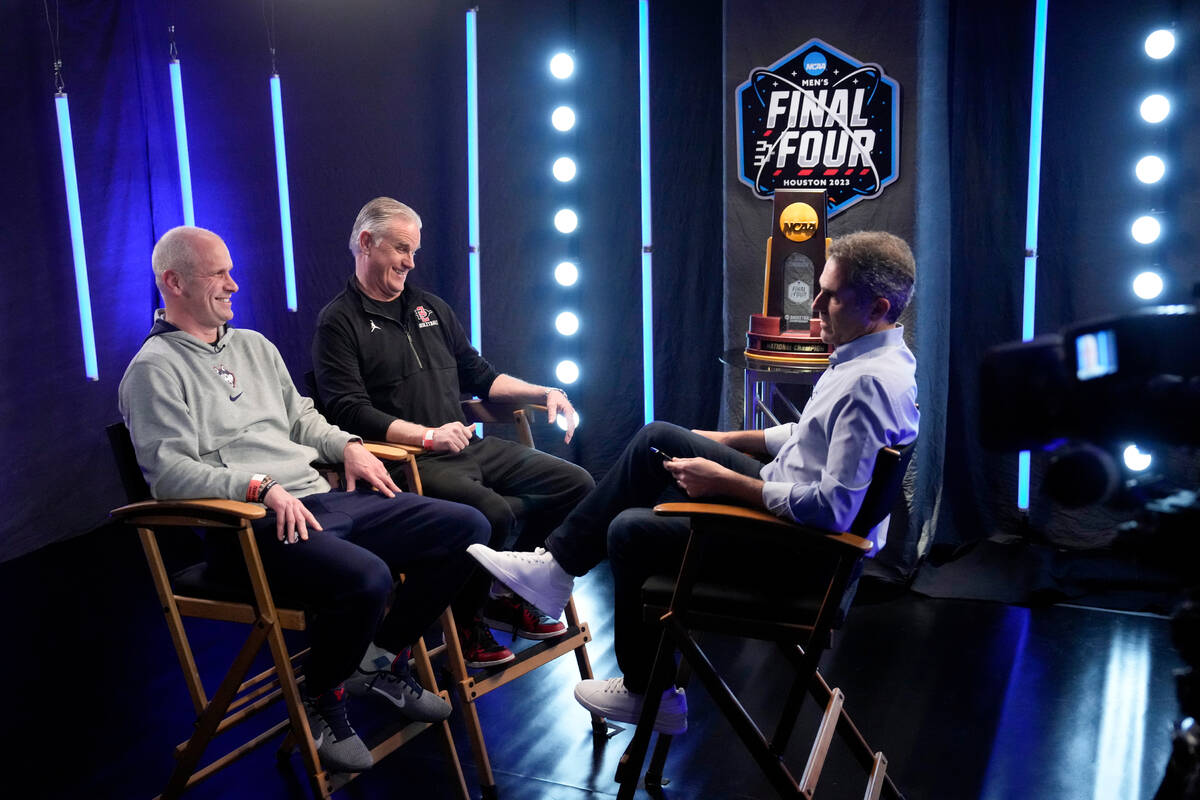 Connecticut head coach Dan Hurley and San Diego State head coach Brian Dutcher speak during an ...