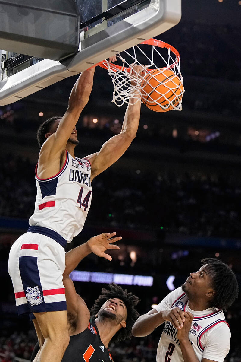 Connecticut guard Andre Jackson Jr. dunks against Miami during the second half of a Final Four ...