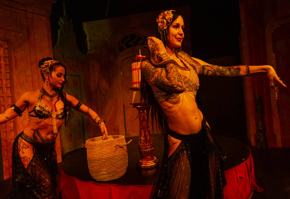 Belly dancers Sabrina Fox, left, and Sara Lyn perform with snakes in the The Seance Room at Los ...