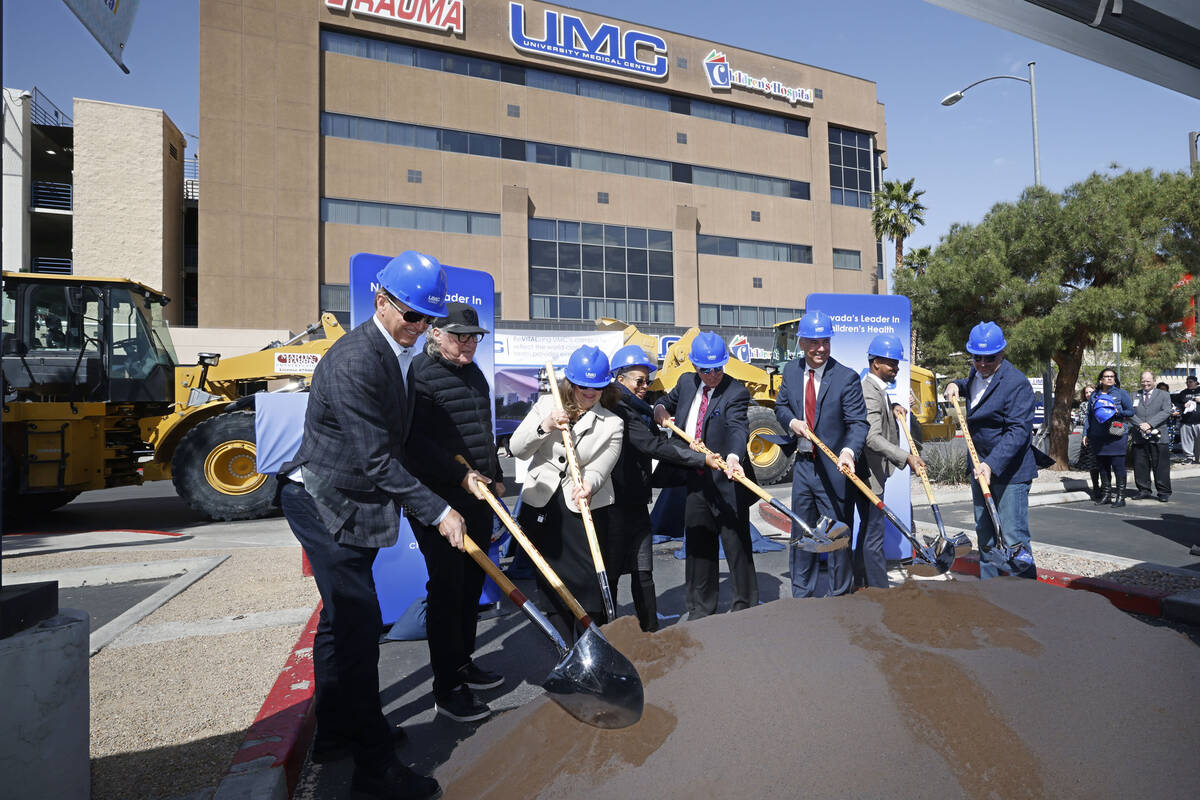 Officials and guests pose for a photo during a groundbreaking ceremony for the ReVITALize UMC F ...