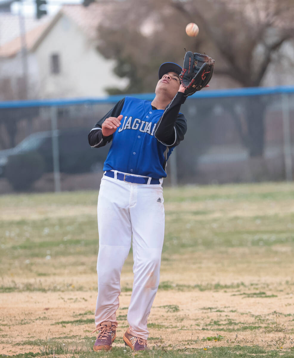 Desert Pines' Gilbert Quintero catches a fly ball from Doral Academy's Kainoa Paul, not picture ...