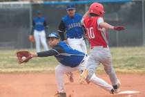 Desert Pines' Eric Milian (14) forces out Doral Academy's Maddox Fikkert (10) during a baseball ...