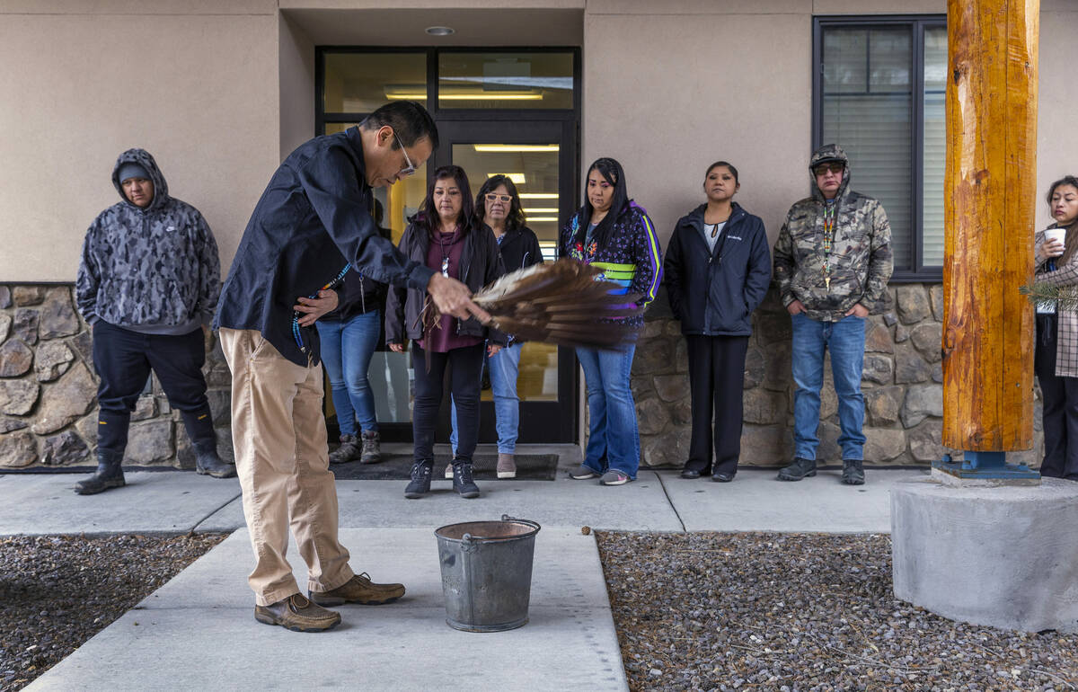 Tribal employees participate in a smudging ceremony in honor of the passing of Shoshone-Paiute ...