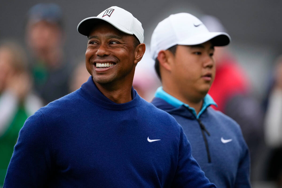 Tiger Woods and Si Woo Kim, of South Korea walk on the 10th tee during a practice for the Maste ...