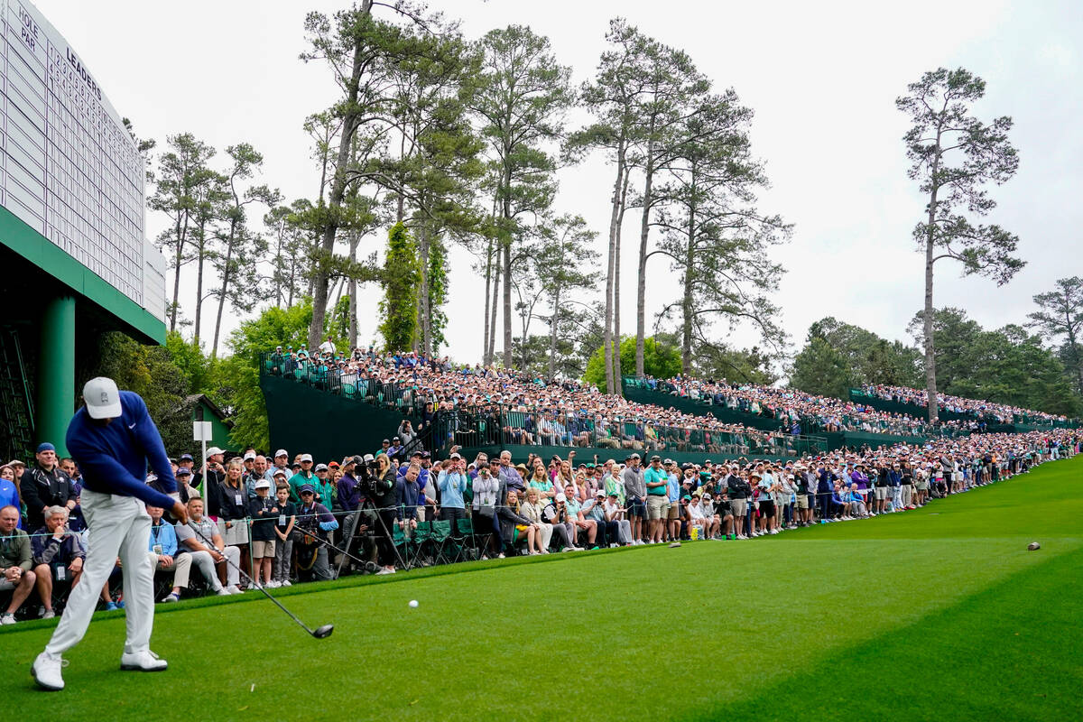 Tiger Woods hits from the 14th tee during a practice for the Masters golf tournament at Augusta ...