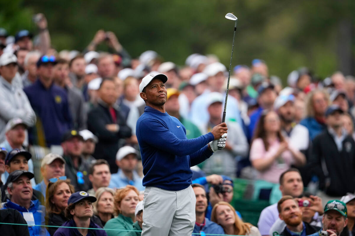 Tiger Woods hits from ther 12th tee during a practice for the Masters golf tournament at August ...