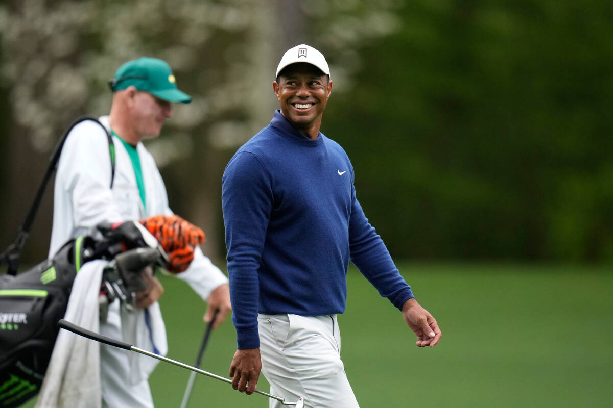 Tiger Woods walks on the 11th fairway during a practice for the Masters golf tournament at Augu ...