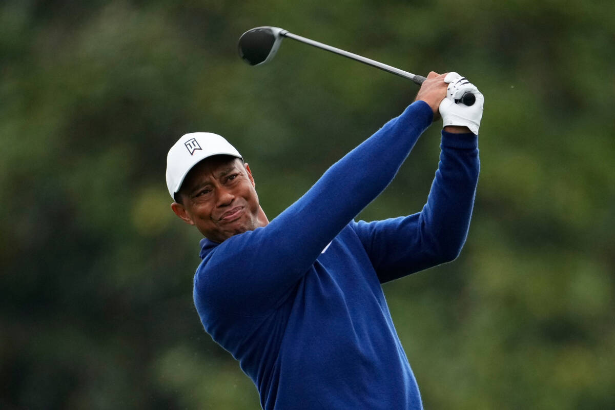 Tiger Woods hits from the 10th tee during a practice for the Masters golf tournament at Augusta ...