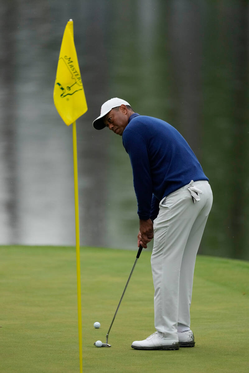 Tiger Woods putts on the 16th green during a practice for the Masters golf tournament at August ...