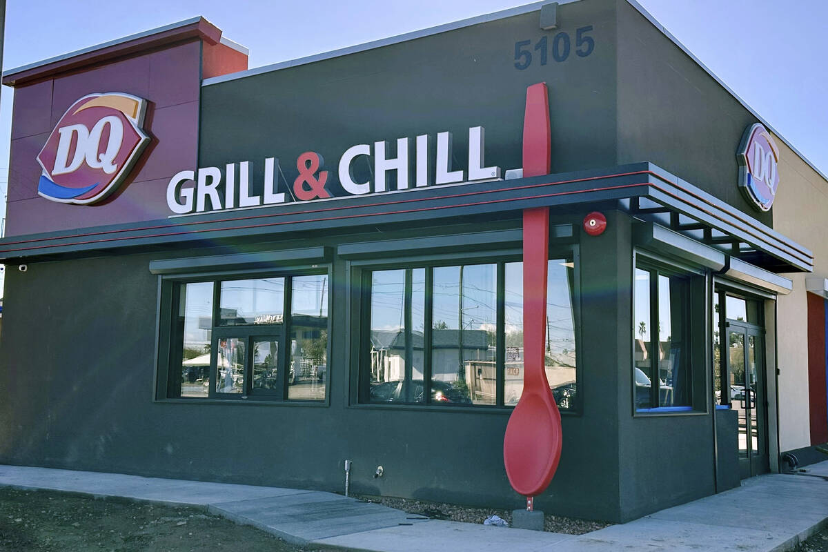 This image shows a Dairy Queen restaurant in Phoenix with a 15-foot-tall red spoon. (Raman and ...