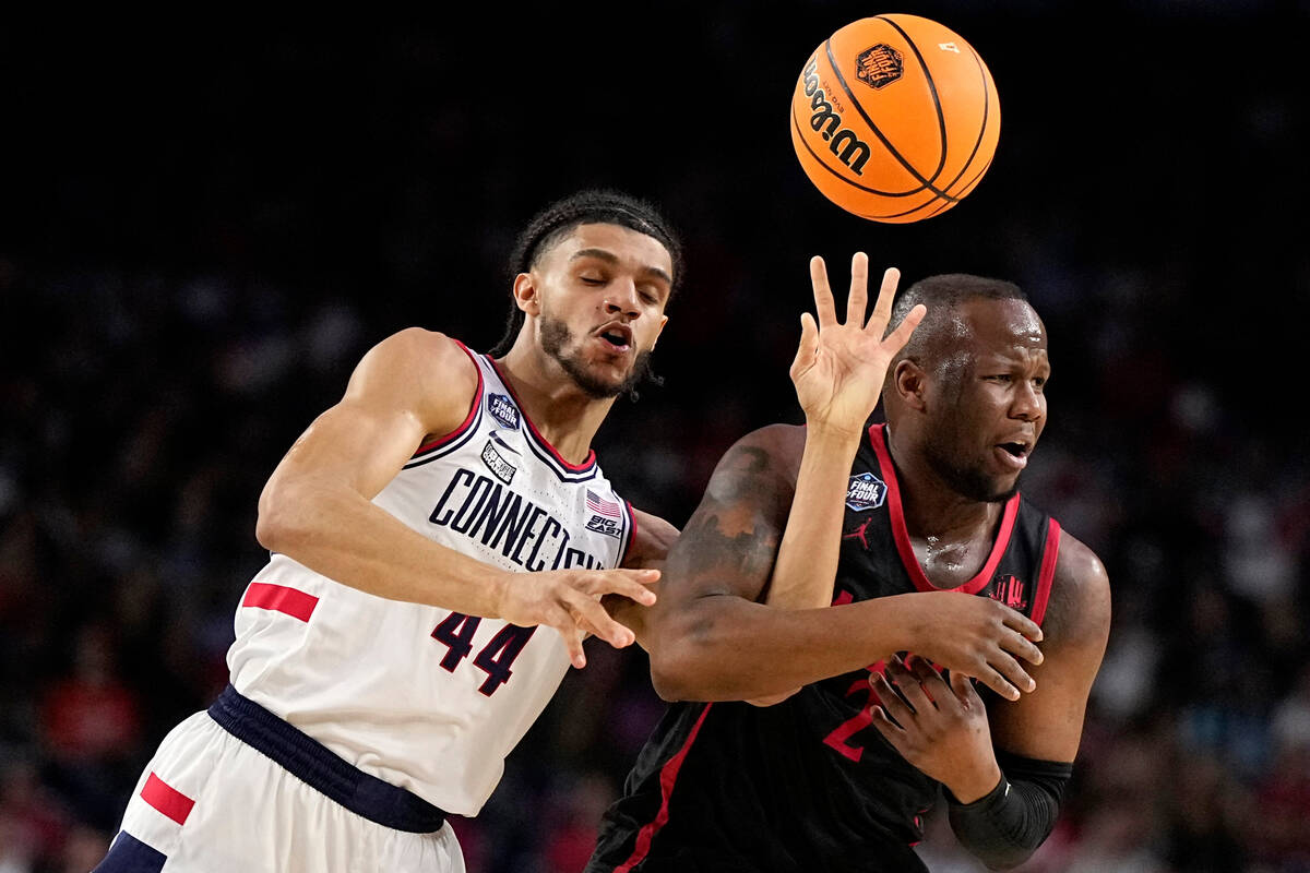 San Diego State guard Adam Seiko vies for the ball with Connecticut guard Andre Jackson Jr. (44 ...