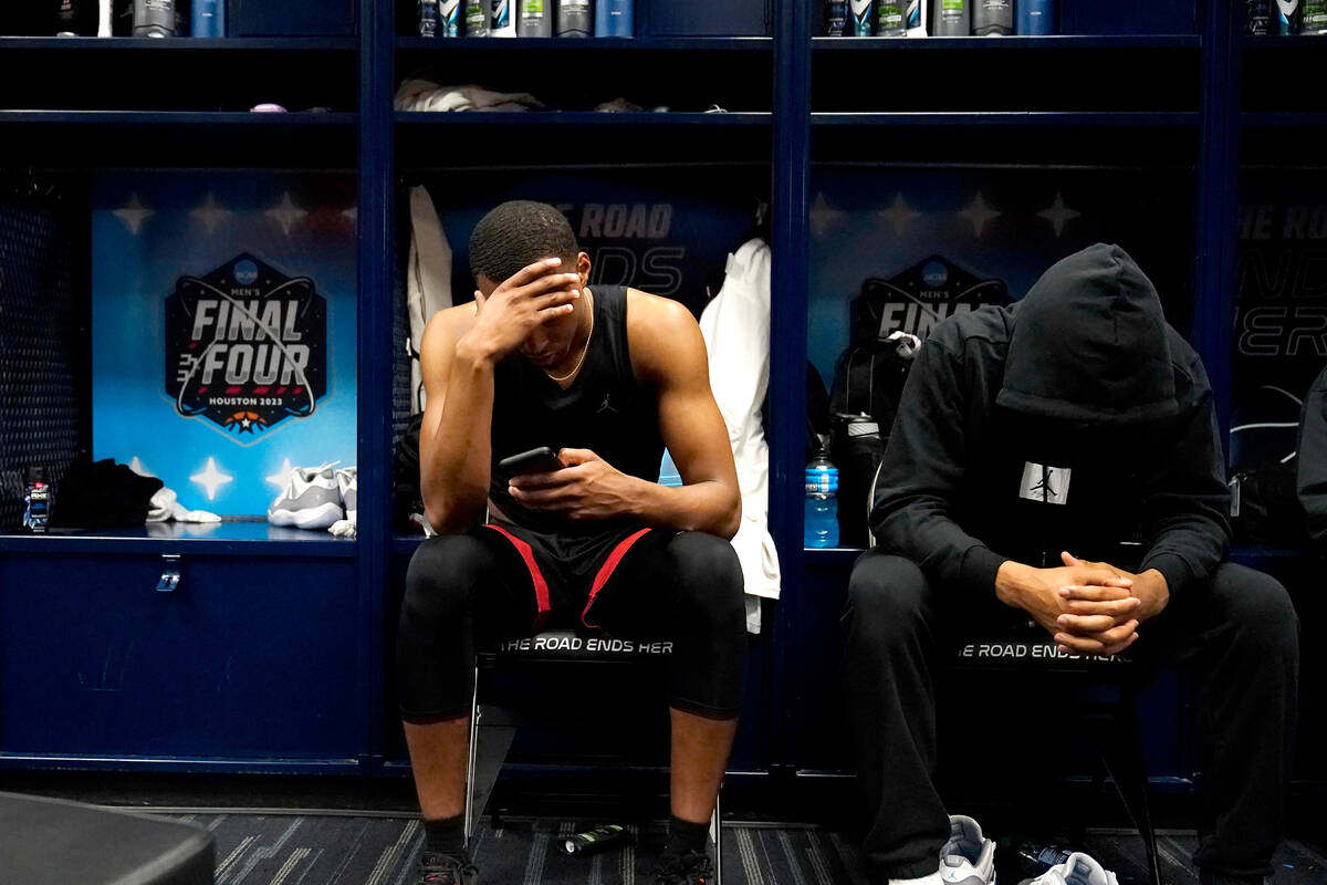 San Diego State guard Micah Parrish and guard Tyler Broughton sit in the locker room after thei ...