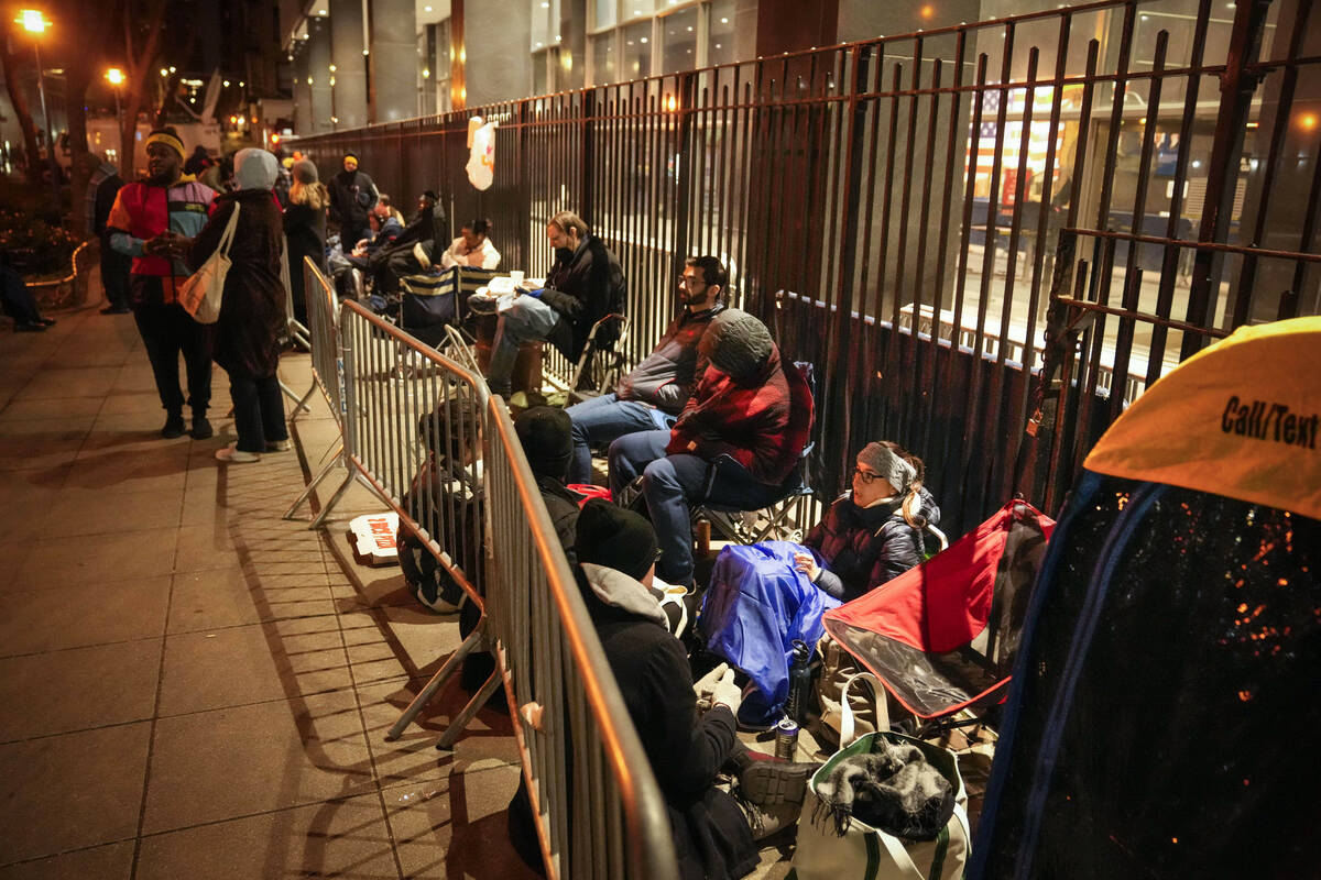 A line for court access is formed outside Manhattan Criminal Court, Tuesday, April 4, 2023, in ...