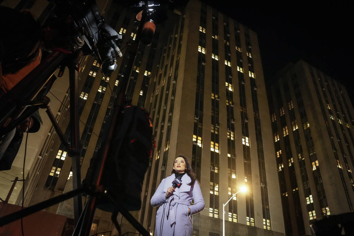Journalists begin their morning reports outside Manhattan Criminal Court, Tuesday, April 4, 202 ...