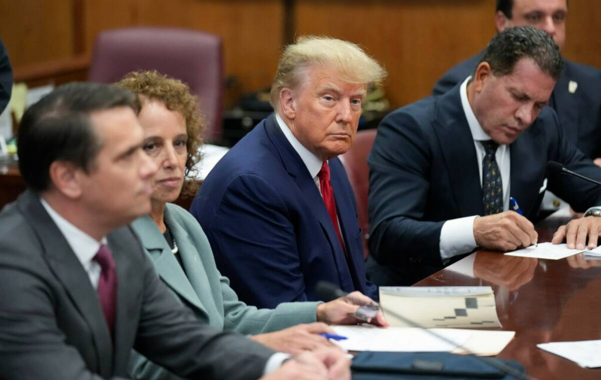Former President Donald Trump sits at the defense table with his defense team in a Manhattan co ...