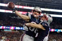 New England Patriots wide receiver Danny Amendola, left, celebrates his touchdown catch with Ch ...
