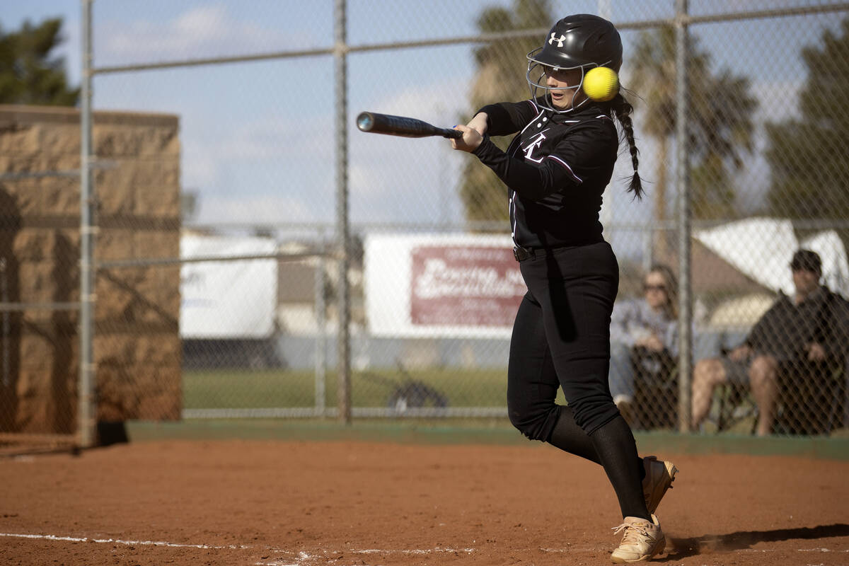 Faith Lutheran’s McKenna Young swings and misses during a high school softball game agai ...