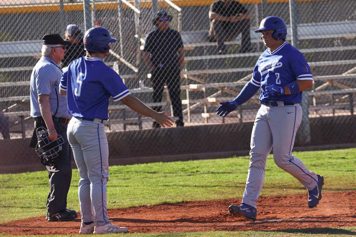 Bishop Gorman shortstop/pitcher Demitri Diamant (5) and third baseman/pitcher Gunnar Myro (8) c ...