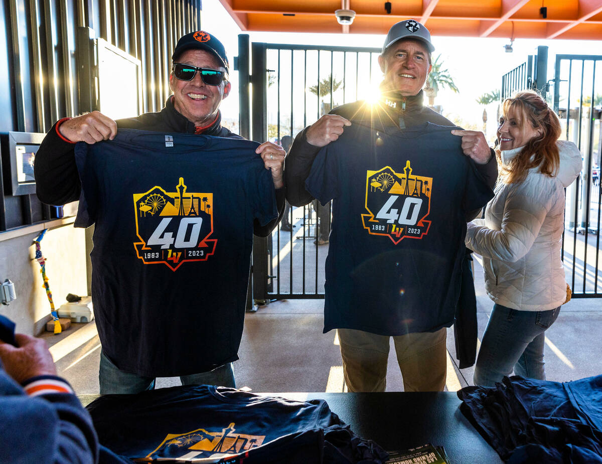 Bill Collins, left, and Mark Roselli show off their free 40th anniversary shirts as the Aviator ...