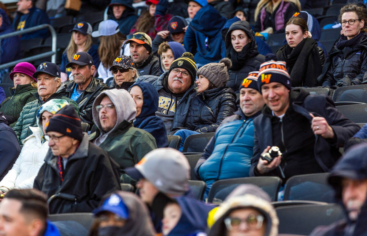 Fans stay warm during the first inning of the Aviators against Dodgers during their minor leagu ...