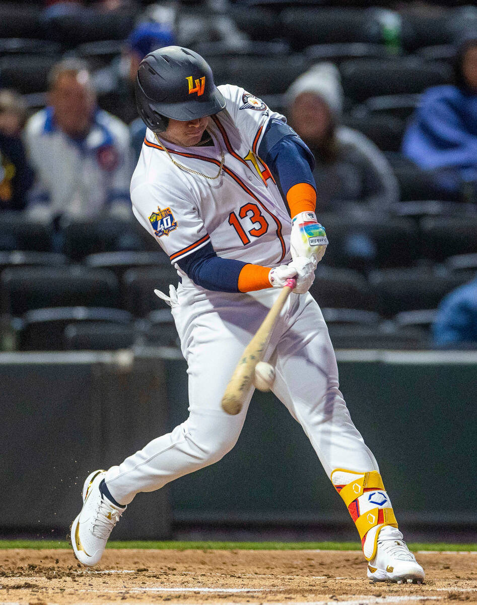 Aviators infielder Jordan Diaz (13) crushes a ball for a hit against the Dodgers during the sec ...