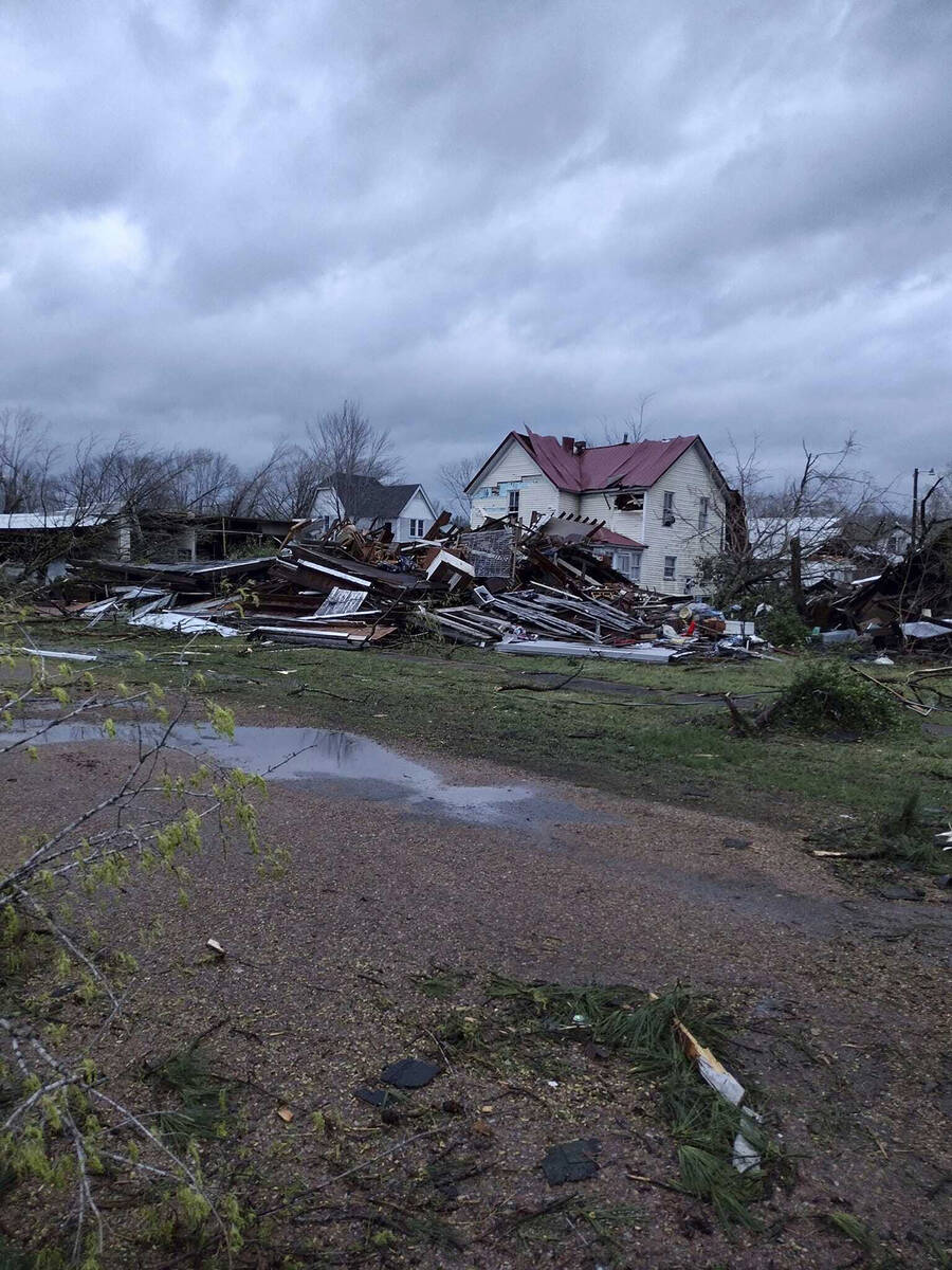 Debris covers the ground as homes are damaged after severe weather in Glen Allen, Mo., on Wedne ...