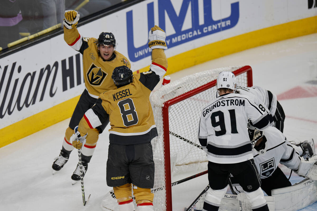 Golden Knights right wing Phil Kessel (8) celebrates with Golden Knights center Ivan Barbashev ...