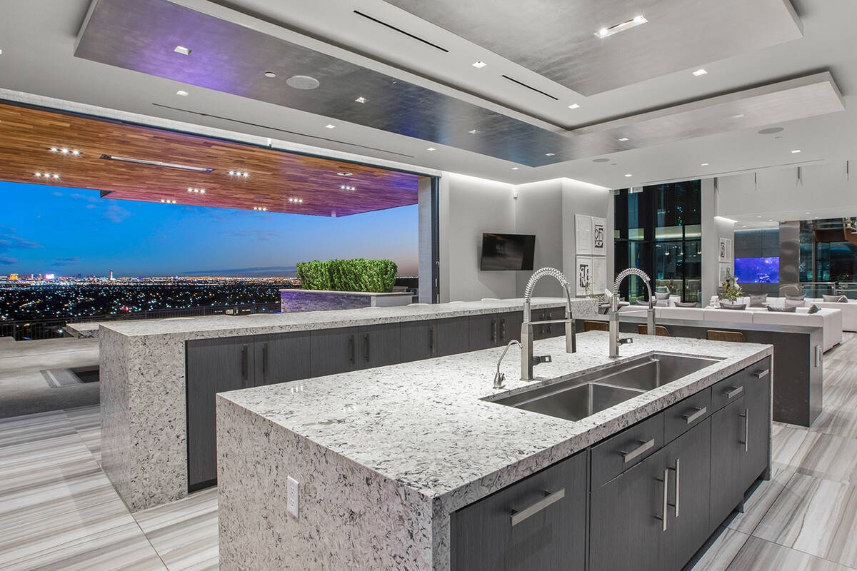 The kitchen leads to a patio. (IS Luxury)