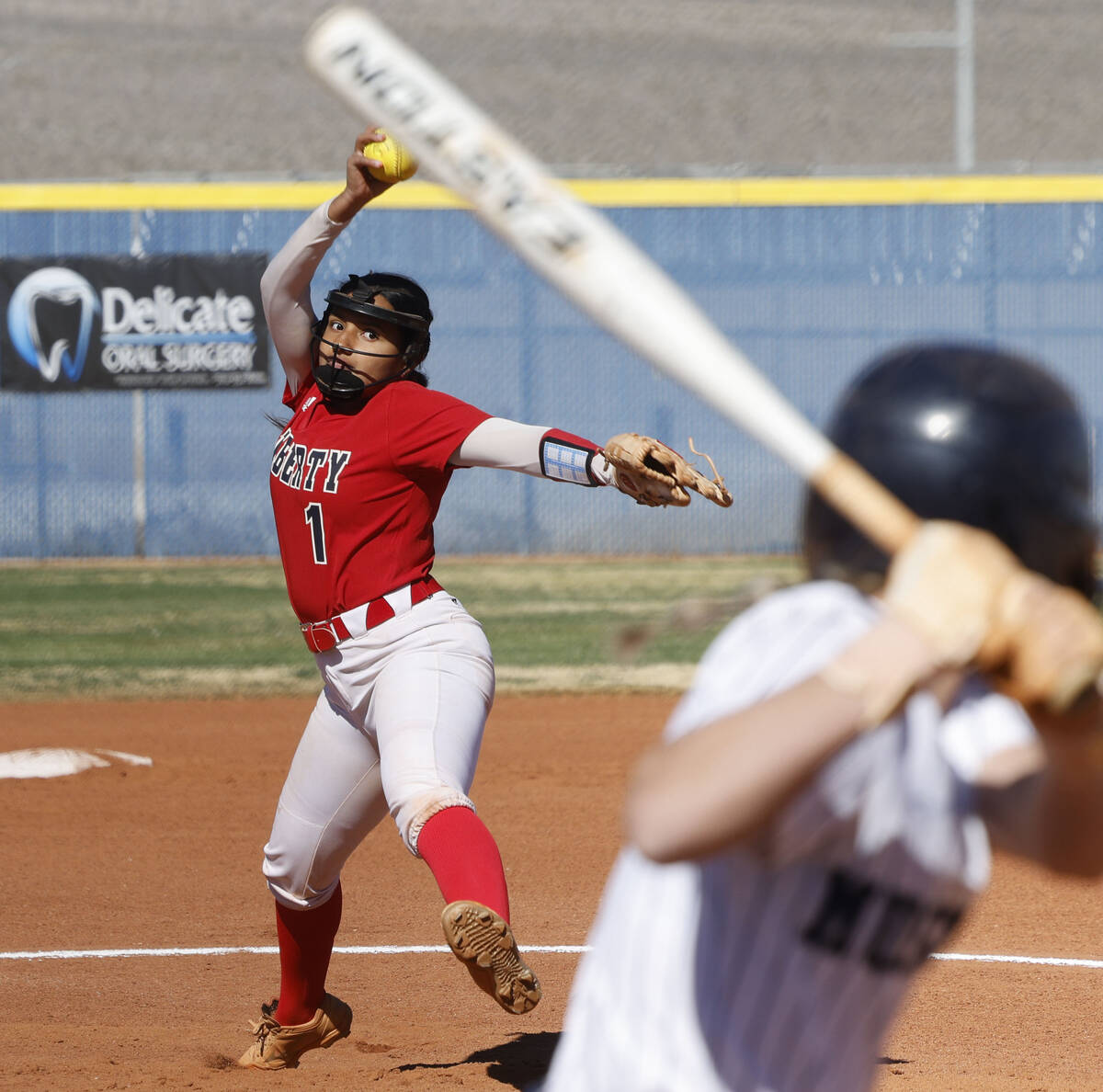 Liberty pitcher Crystal Warren (1) delivers to Shadow Ridge's Stevie Robison (1) during the fir ...