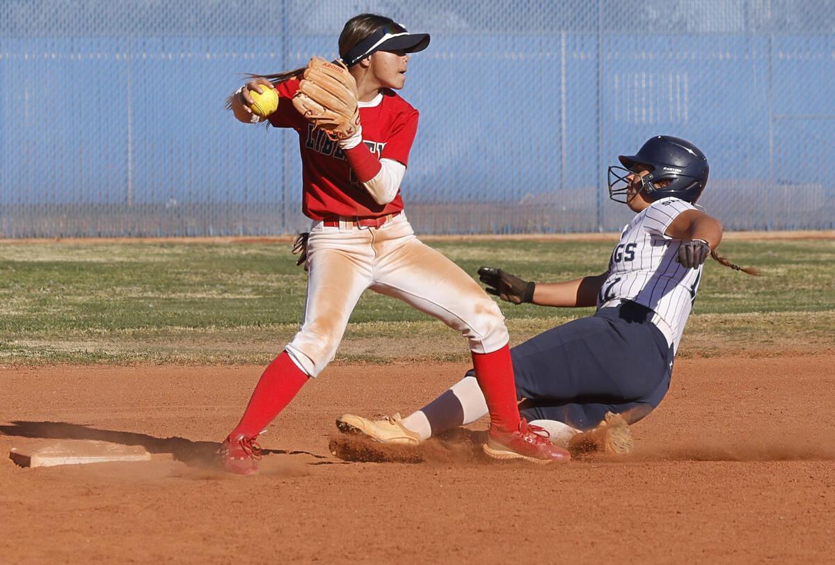 Liberty's Jaydah Chun (50), left, throws to first for a double play after forcing out Shadow Ri ...
