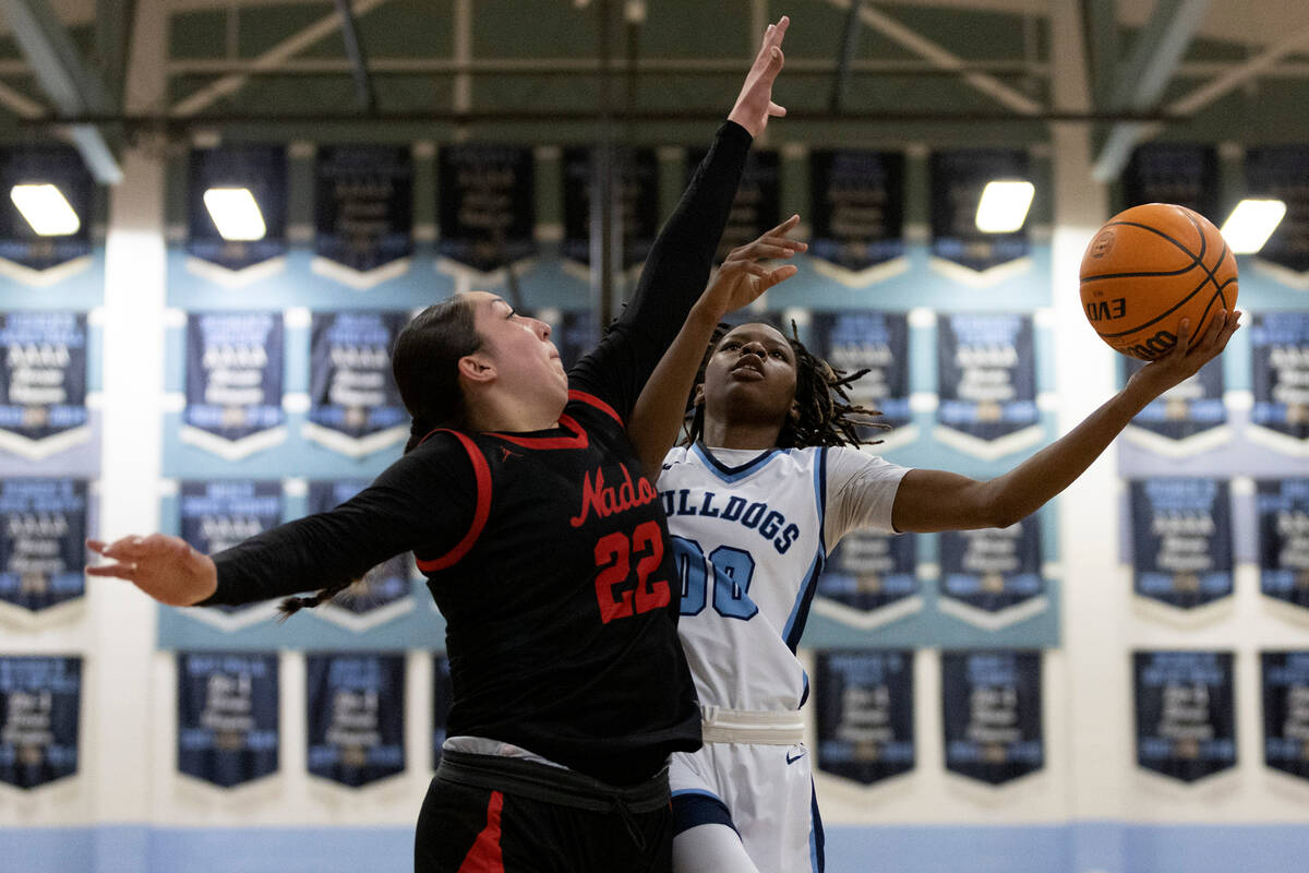 Centennial guard Kaniya Boyd (00) shoots against Coronado forward Ashtyn Wick (22) during ...