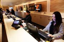 Front desk clerks Parima Rasouli, right, and Ruby Cruz work at the Four Queens in downtown Las ...