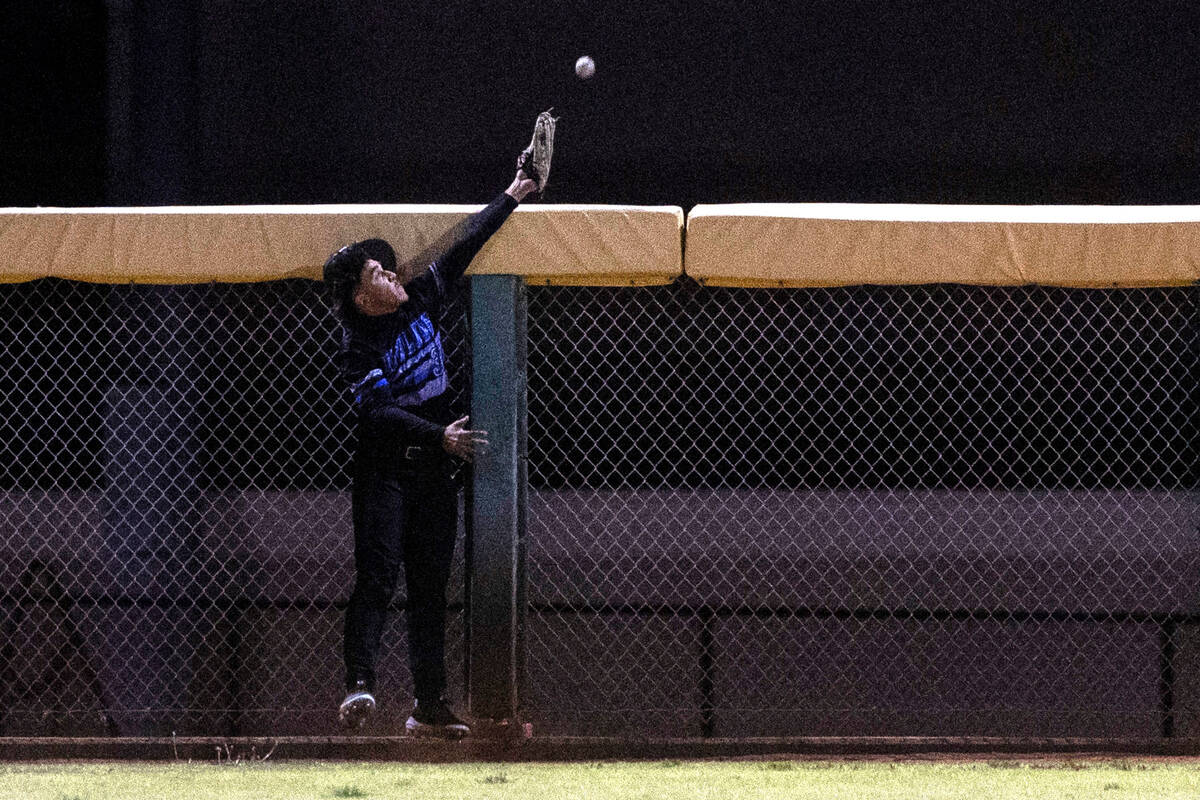 Basic outfielder Marcus Troyano misses the catch on Bishop Gorman first baseman Easton Shelton& ...