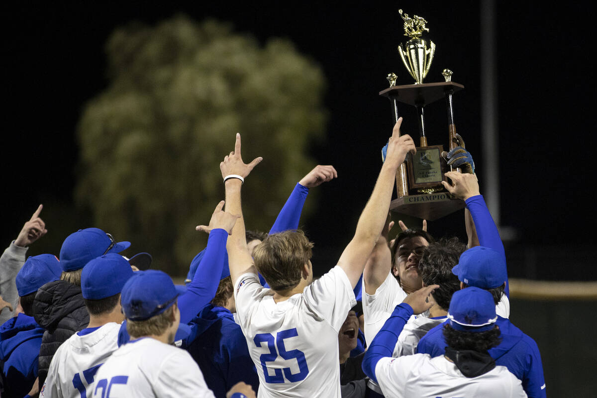 Bishop Gorman holds up their trophy after winning a high school baseball championship game agai ...