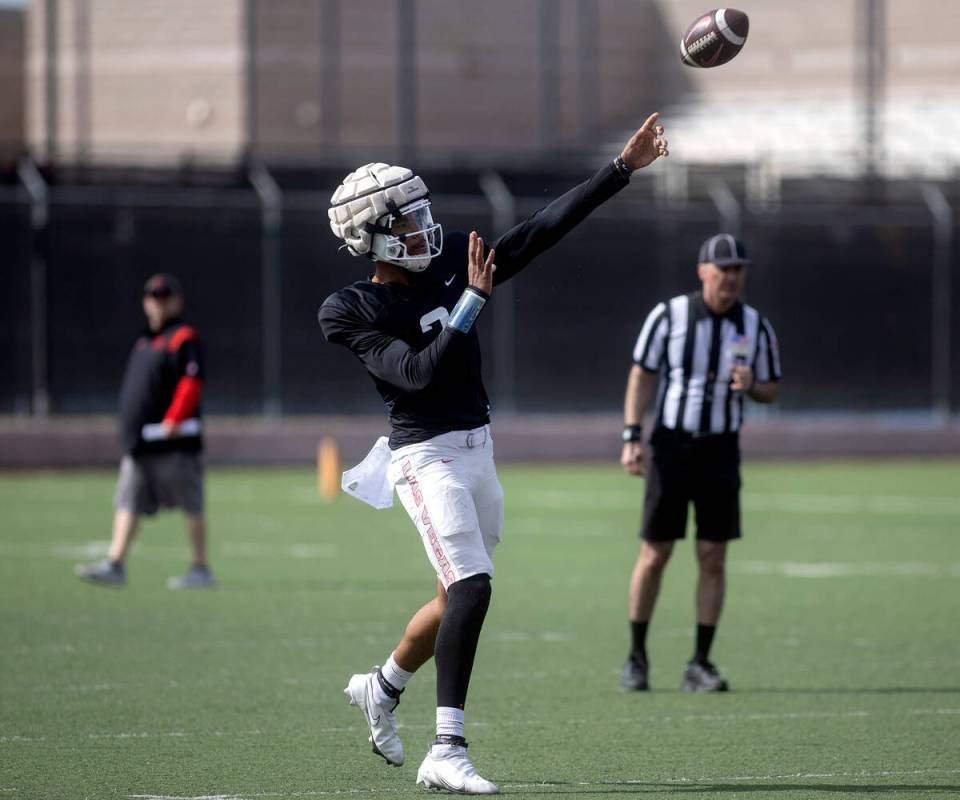 Quarterback Doug Brumfield throws during UNLV football practice at Fertitta Football Complex on ...